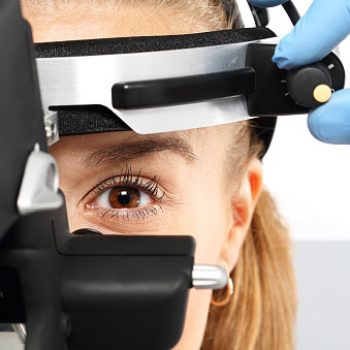 Ophthalmologist examines the eyes using a ophthalmic device